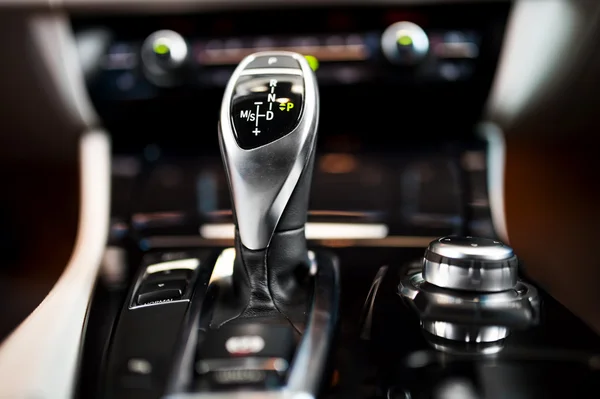 https://st.depositphotos.com/1387241/4791/i/450/depositphotos_47912877-stock-photo-detail-of-an-automatic-gear.jpg